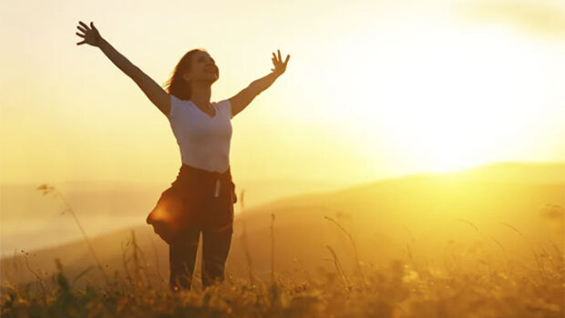 Empower Yourself Empowered, rejuvenated woman on a hilltop