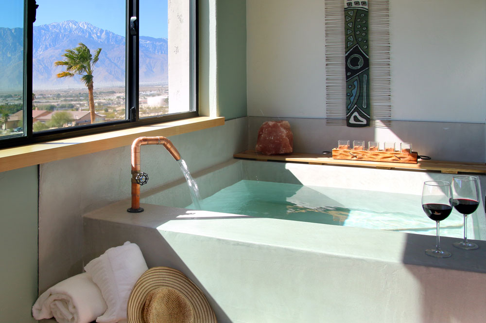 In-room private mineral water soaking tub in the Spa Suite rooms at Azure Palm Hot Springs